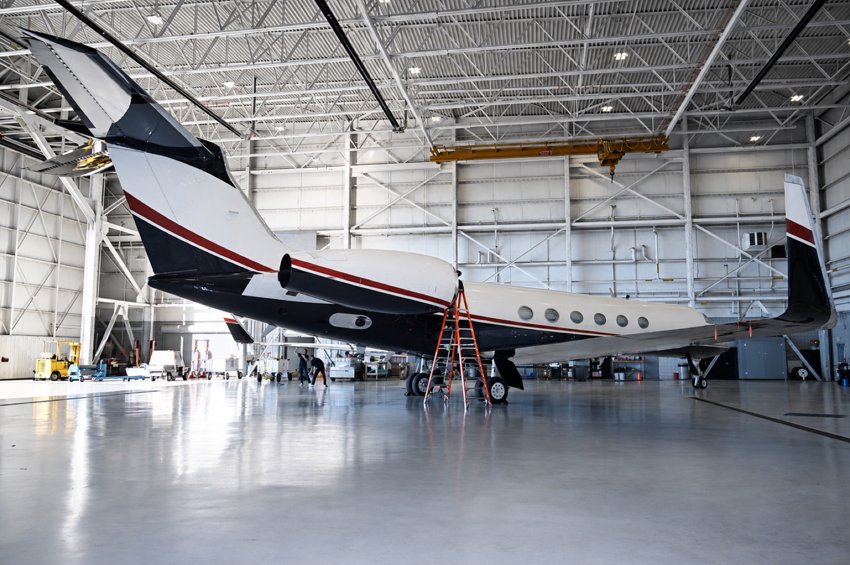 Gulfstream G4 tail detailed by A+J Finish in a Michigan hangar