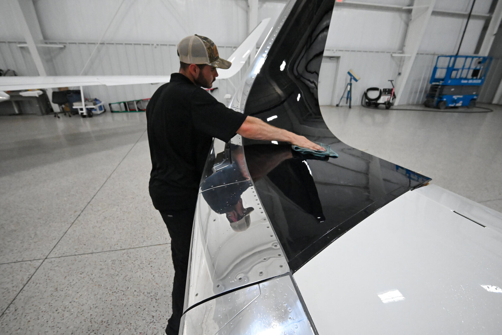 Hand-washing the fuselage with a wash pole